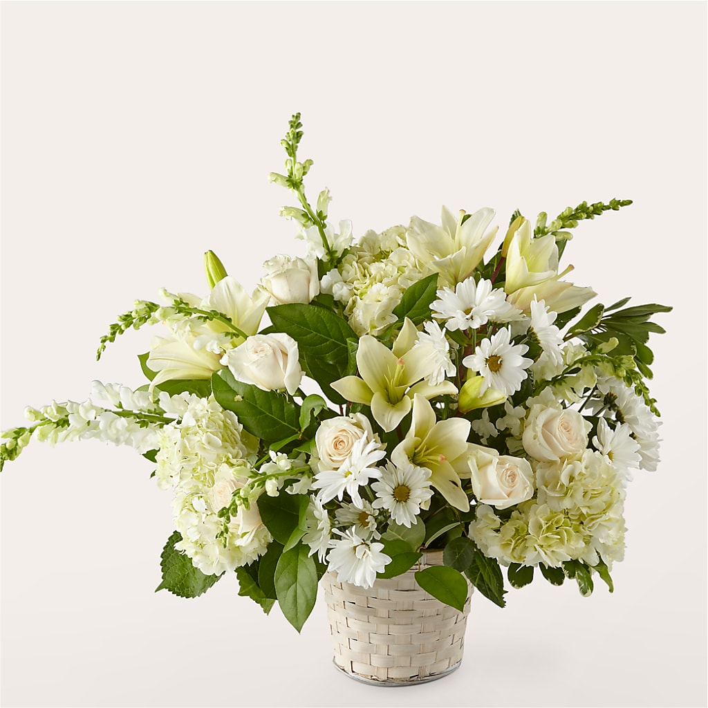 Cesta floral con elegancia de color marfil