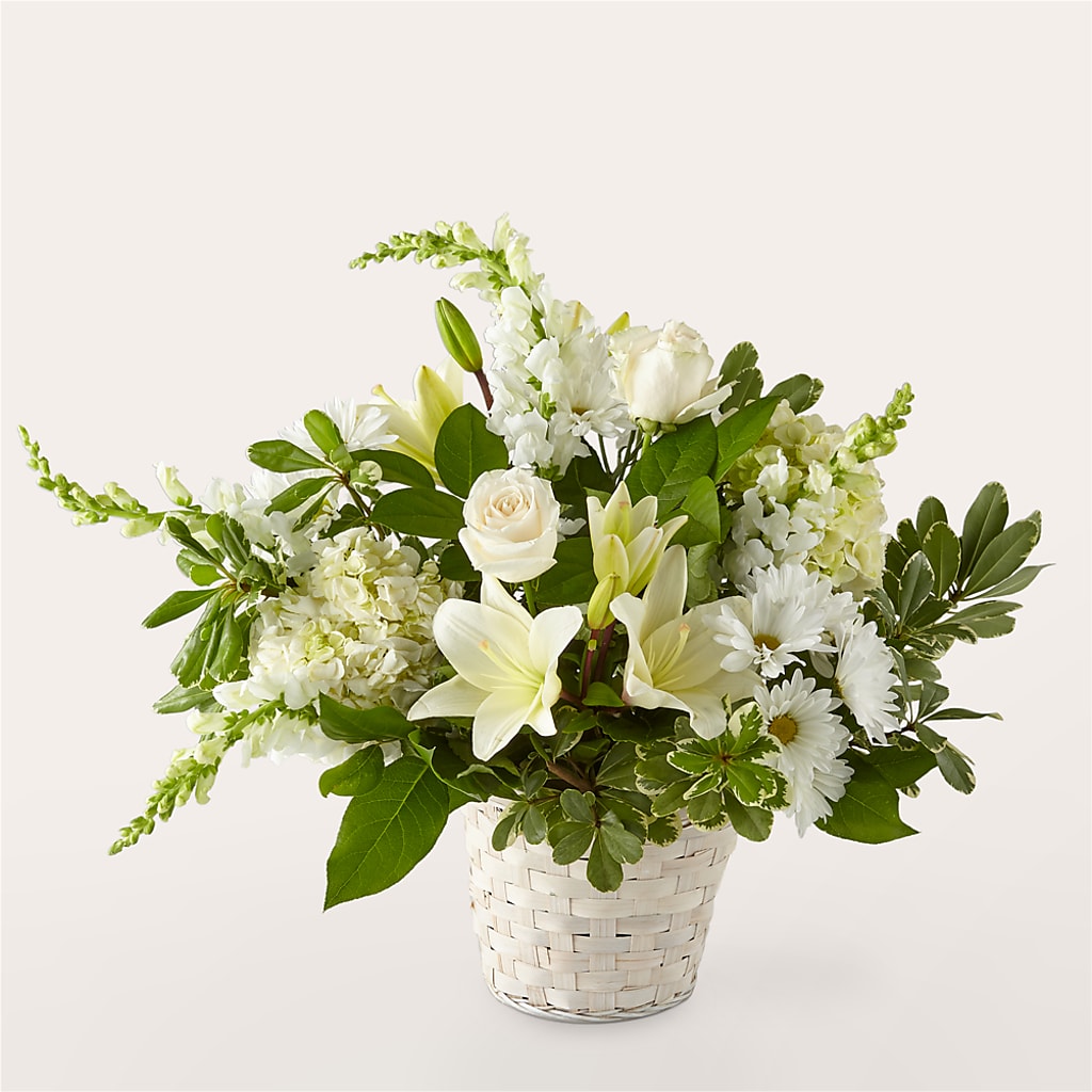 Cesta floral con elegancia de color marfil